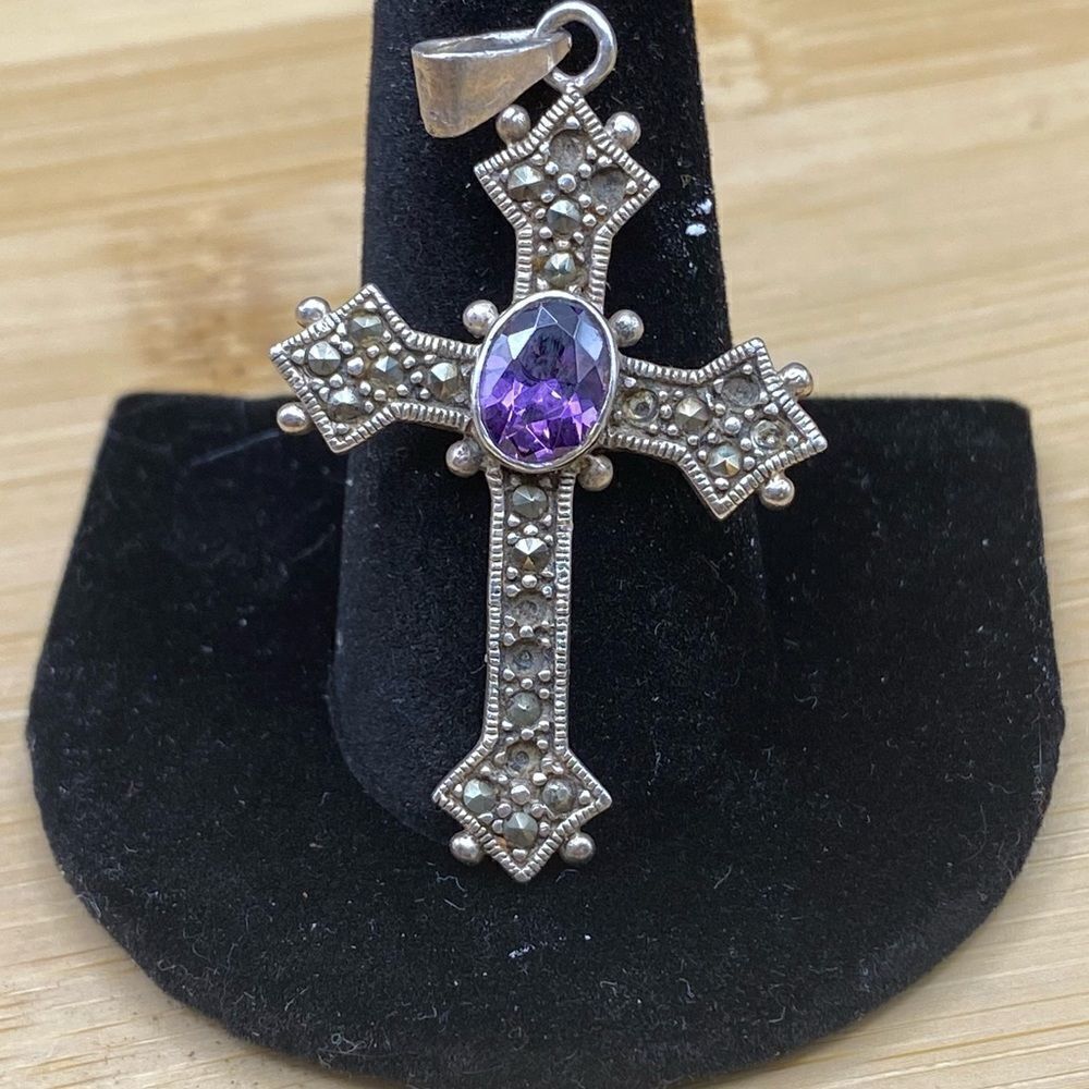 925 silver cross w/Hematites and 6x8 purple Amethyst oval stone.  See below👇🏻